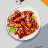 Smoking BBQ Bliss Chicken Wings · Fresh chicken wings breaded, fried until golden brown, and tossed in barbecue sauce.