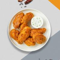 Mango Tango Habanero Wings · Fresh chicken wings breaded, fried until golden brown, and tossed in mango habanero sauce.