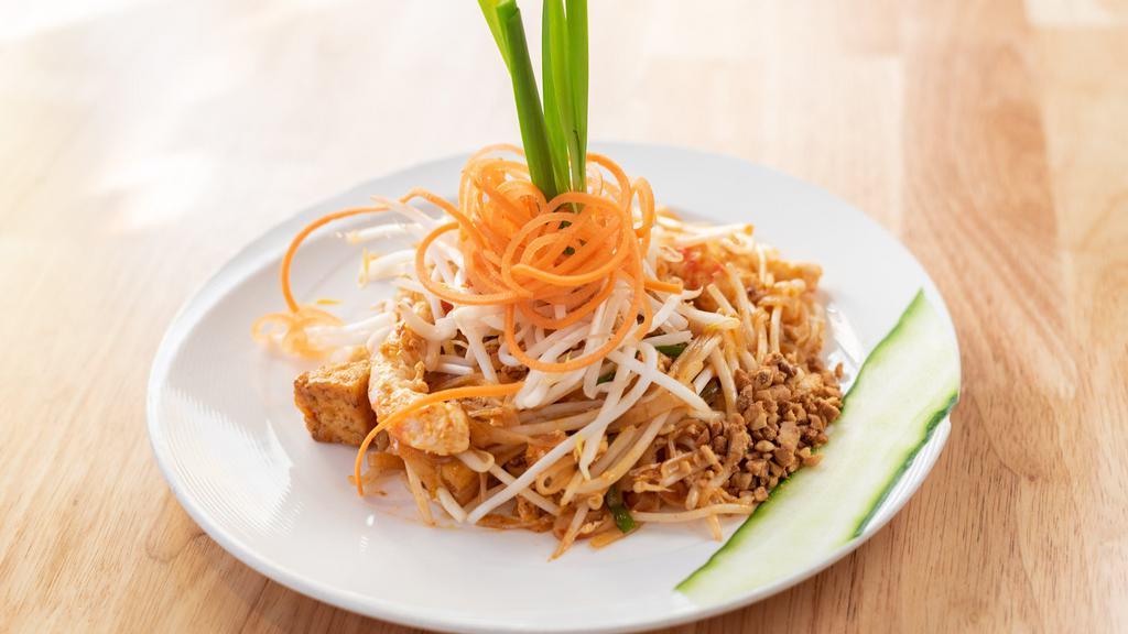 Pad Thai · Contains nuts. Pan-fried rice noodles with tofu, bean sprouts, chives, ground peanuts and egg.