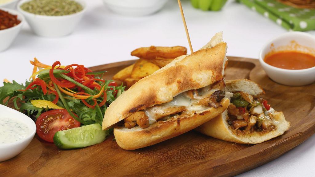 Chicken Philly Cheesesteak À La Carte · Chef's famous philly on french roll with chicken, bell peppers, onions, mushrooms & jack cheese!
