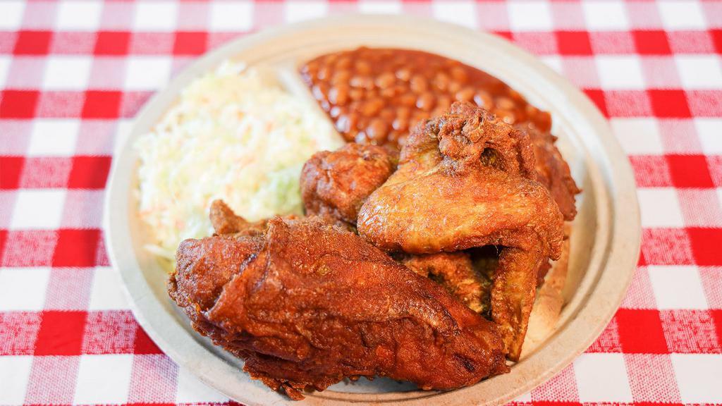 Half Chicken Plate · 1 Breast, 1 Thigh, 1 Leg, and 1 Wing.  
Includes Baked Beans and Cole Slaw.