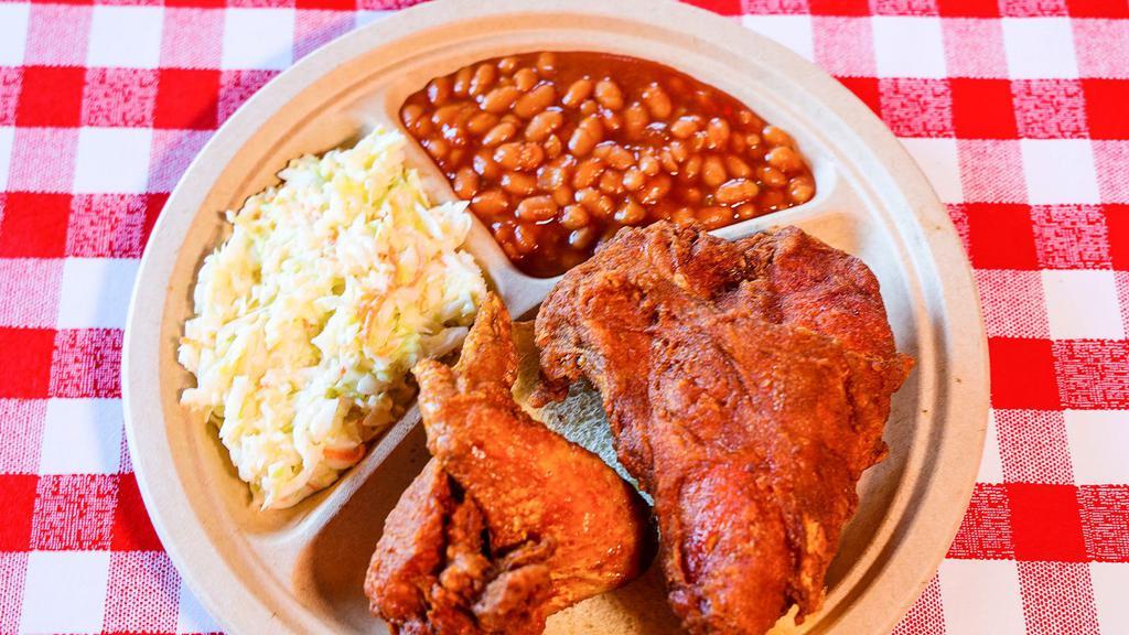 2 Piece White Plate · 1 Breast and 1 Wing.  Includes Baked Beans and Cole Slaw.