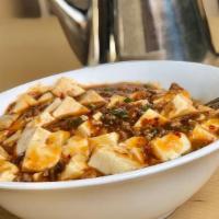 Mapo Tofu / 麻婆豆腐 · Soft tofu set in a light spicy broth, can be made not spicy and vegetarian (if you choose th...