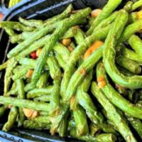 Dry-Sautéed String Beans / 干煸四季豆 · Long string beans are sautéed with peppers and garlic. Can be made not spicy upon request.