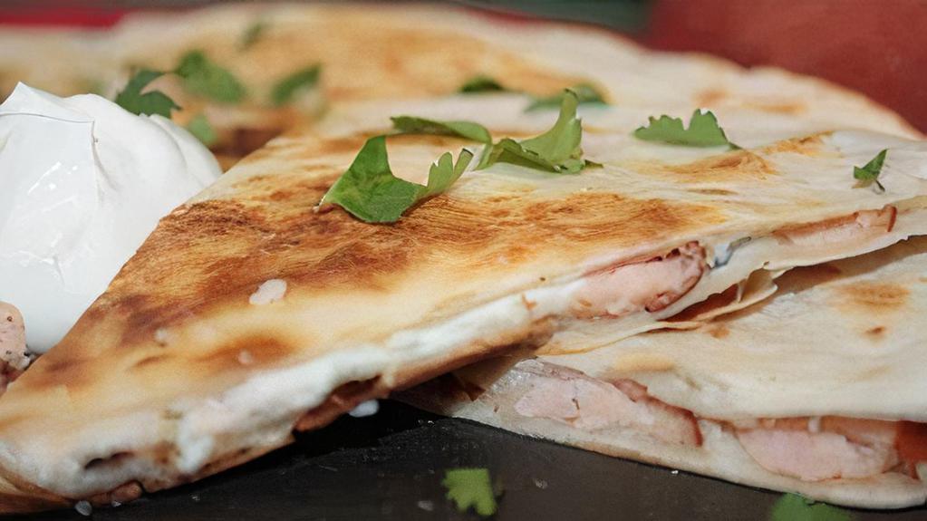 Smoked Quesadillas · Quesadillas with a side of salsa.