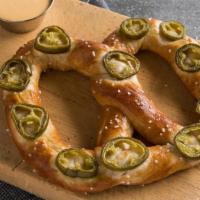 Jalepeno Cheese Pretzel · The soft Jalapeño Pretzel will spice up your snacking experience. A pretzel topped with deli...
