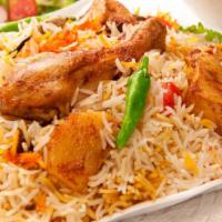 Chicken Biryani · Chicken pieces blended with aromatic sauce and cooked with aged basmati rice.
