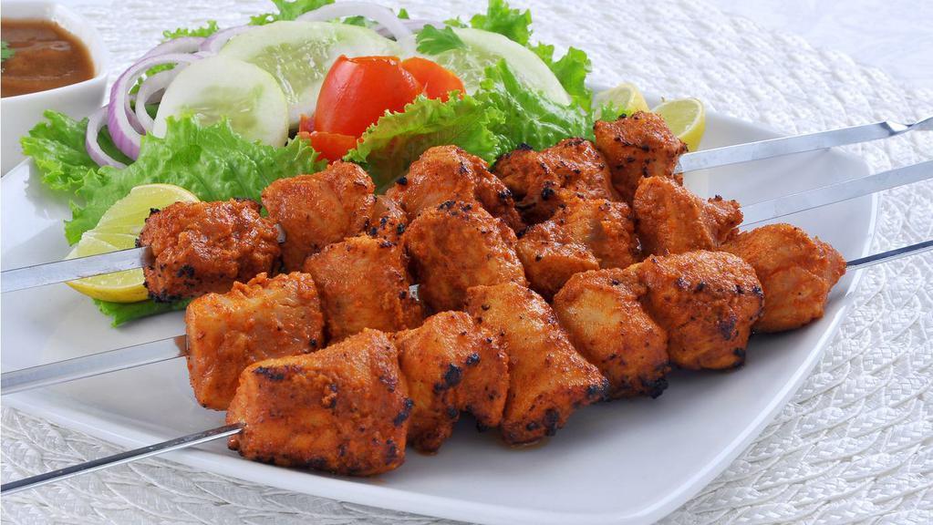 Chicken Boti · Boneless chicken cubes marinated, skewered and cooked in clay oven.