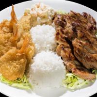 Seafood Combo · One fried fish, three butterfly shrimp one scoop of macaroni salad, two scoops of rice and y...
