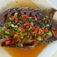 54. Pla Sarm-Rot · Crispy fried whole fish layered with chopped bell pepper and cilantro in sweet chili sauce.