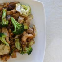 74. Pad See-Ew · Pan-fried noodle with egg, broccoli, and sweet soy sauce. Choice of sliced chicken, beef or ...