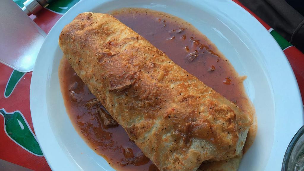 Burritos Grandes (Carne Asada) · Large flour tortilla, stuffed with rice, beans & carne asada. Served wet, topped with our delicious house sauces. Add guac, cheese, and sour cream for additional cost.