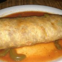 Burritos Grandes (Shrimp) · Large flour tortilla, stuffed with rice, beans & shrimp. Served wet, topped with our delicio...