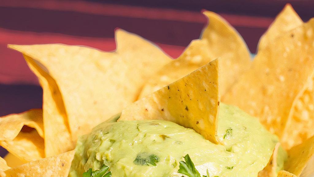 Guacamole Con Chips Y Salsa · Puerto's #1 avocado dip, seasoned & spiced just right.