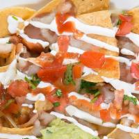 Nachos · Fresh chips, topped w/beans, cheese & special taco sauce.