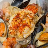 Fettuccine Fruitti Di Mare & Lobster · Fresh Fettuccine Pasta In lobster bisque sauce with mussels, prawns, and calamari. Served al...