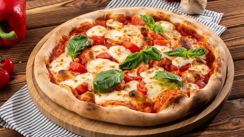 Pizza Fiordi late · Margherita sauce with fior di latte mozzarella cheese, topped with freshly sliced Tomatoes (10 inches)