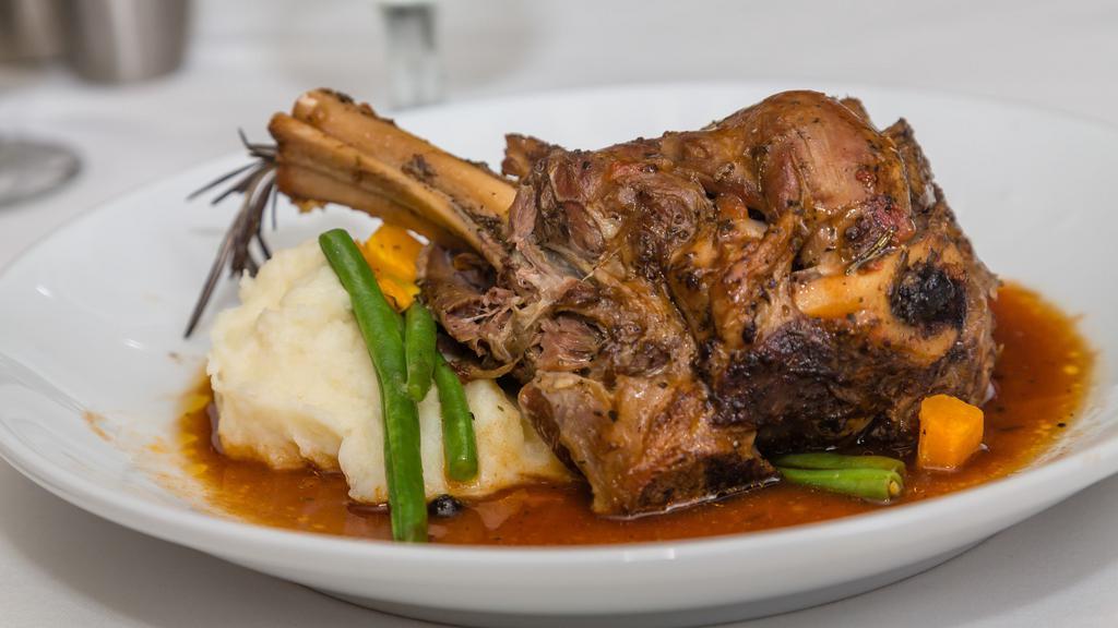 Lamb Shank  · Oven Braised lamb shank with marinara, carrots, onions, celery, our mixed spices served with rice or mashed potatoes
