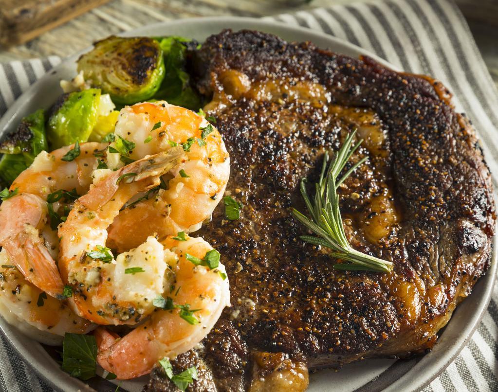 Shrimp & Ribeye · Juicy Ribeye Steak rich in flavor alongside with Flavorful Shrimp. Comes with creamy Mashed Potatoes and vegetables.
