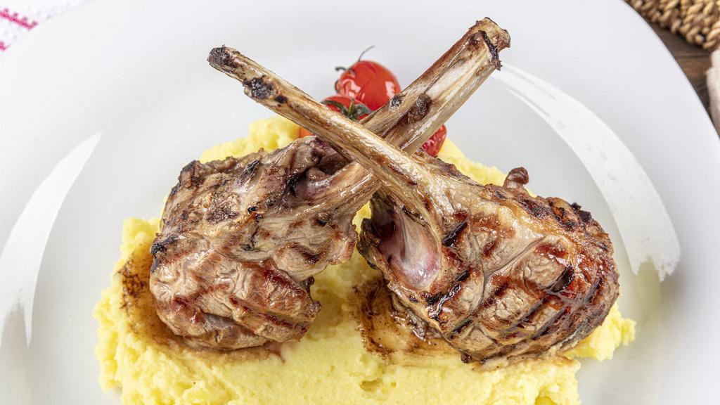 Lamb Rack · Grilled and Seasoned Lamb Rack cooked to perfection. Comes with a side of creamy mashed potatoes and vegetables