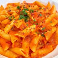 Penne Arrabbiata · Spicy Garlic Marinara Topped with Chili Flakes, Cream, and Parmesan Cheese