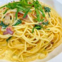 Spaghetti Carbonara · Beef Bacon, Garlic, Egg Yolk, Salt, and Pepper in a Creamy Sauce.