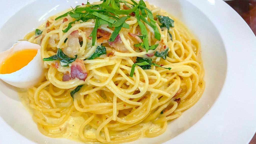Spaghetti Carbonara · Beef Bacon, Garlic, Egg Yolk, Salt, and Pepper in a Creamy Sauce.