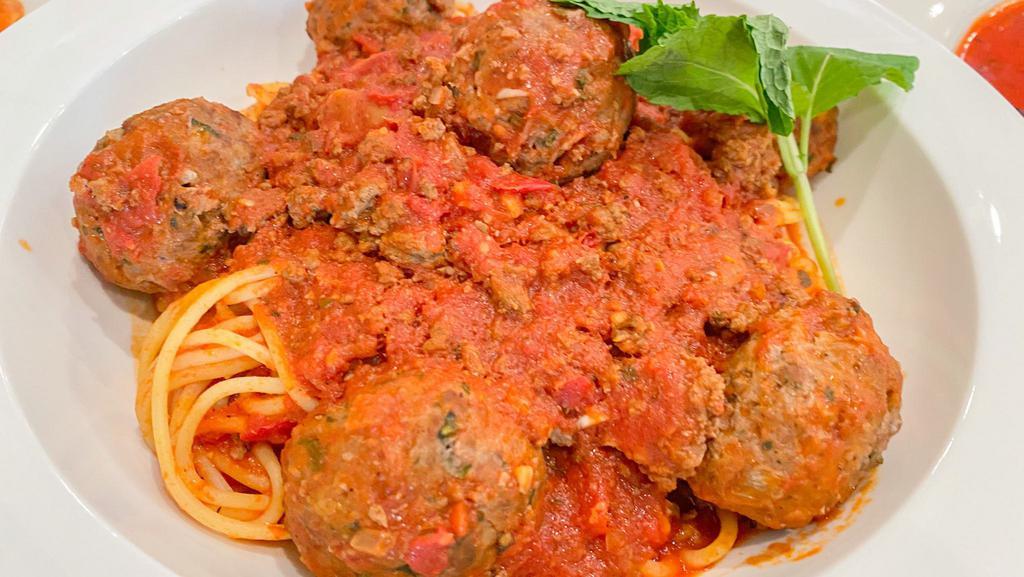 Spaghetti and Meatballs · Spaghetti Pasta in Marinara sauce, topped with Meatballs made with Fresh Ground Beed, Garlic, Onions, Mint, Parmesan Cheese, Eggs, Salt, Pepper, and Dijon Mustard.