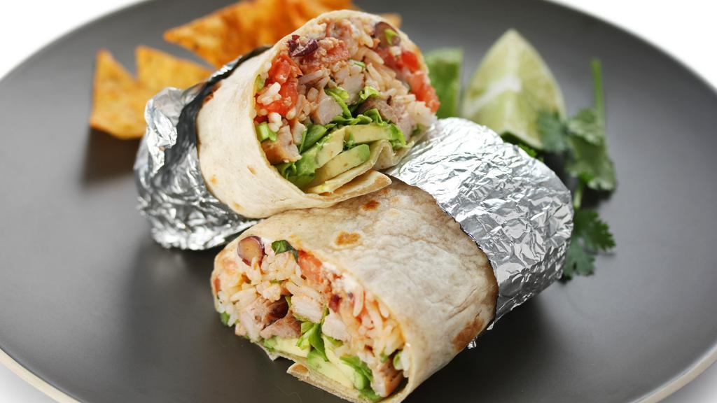 Super Burrito · Flour tortilla stuffed with rice, choice of beans, guacamole, Pico de Gallo, cheese and sour cream served  with your choice of protein. Comes w/ Chips & Salsa
