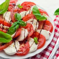 Caprese Salad · Roma Tomatoes, Kalamata Olives, Buffalo Mozzarella, Fresh Basil, Balsamic Vinaigrette, Salt,...