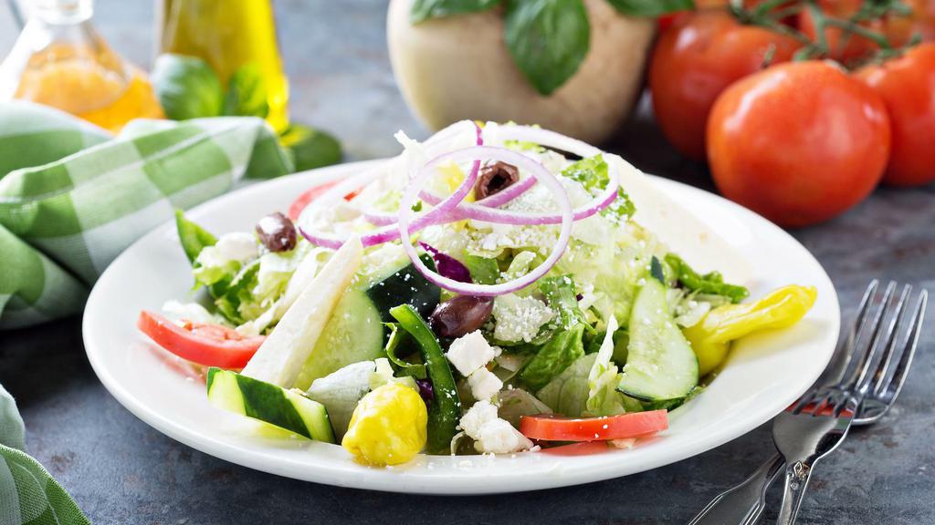 House Salad · Fresh Salad with Tomatoes, Cucumbers, Red Onions, and Mixed Greens served with Italian Heart Vinaigrette