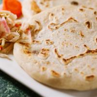 Frijol Con Queso Pupusa · Pupusa made with corn dough mixed with rice pour filled with refried beans, mozzarella chees...
