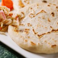 Chicken & Cheese Pupusa · Pupusa made with corn dough mixed with rice flour willed with chicken, mozzarella cheese, an...