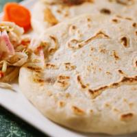 Zucchini & Cheese Pupusa · Pupusa made with corn dough mixed with rice flour filled with Zucchini, Mozzarella cheese, a...