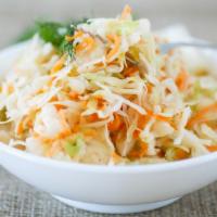 Coleslaw · Aramex Coleslaw, shredded cabbage, carrots, fennel seeds, white vinaigrette, mayo, and sugar