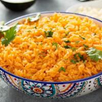 Spanish Rice · Jasmine rice cooked with Carrots, Peas, Corn, Green Beans and Chicken base