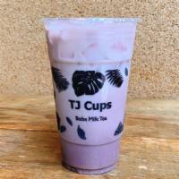 Real Taro Fresh Milk Tea · Taro milk tea with real taro chunks, top with whole milk