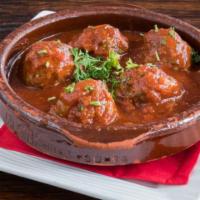 Albondigas · Beef and lamb meatballs, tomato-onion sauce.