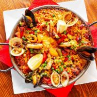 Paella Royale (GF) · Bomba rice,  bell pepper, prawns, calamari, Manila clams, mussels, chicken, spanish chorizo,...
