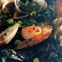 Black Paella (GF) · Bomba rice, squid, Manila clams, mussels, prawns, artichoke, bell pepper, squid ink.