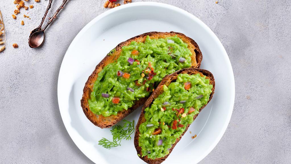 A Toast For Avo · Freshly sliced avocado gently pressed against toast.