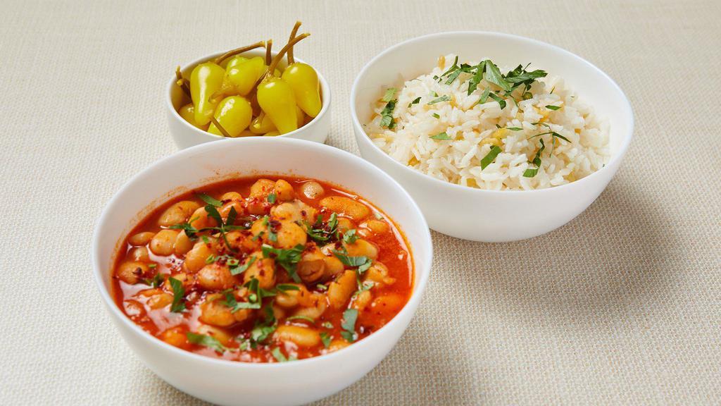 Vegan Bean Stew · Traditional Turkish bean stew cooked with onion and pepper paste. Served with jasmine rice with gluten-free orzo and pickled pepper. Vegan. Gluten-free.