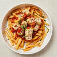 Vegan Tofu Fries Bowl · Gluten-free soy sauce and sesame oil baked tofu with homemade tomato sauce over a bed of cri...