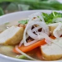 18. Phở Chay · Vegetarian noodle soup with fried tofu, carrot, mushroom, and bok choy sum.