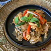 Drunken Noodles · Rice noodles stir-fried with thai spices, fresh chili, basil leaves, broccoli and choice of ...