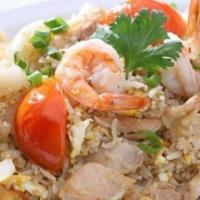 Combination Fried Rice · Shrimp, chicken, beef and pork stir fried with rice, tomato and egg. Topped with scallion.