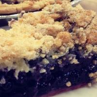 Blueberry Crumble Pie · Wild Maine blueberries cohabiting under our butter crumb topping. 6-inch and 9-inch pies.