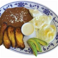 Desayuno Típico Hondureño · With egg, fried platano, sour cream