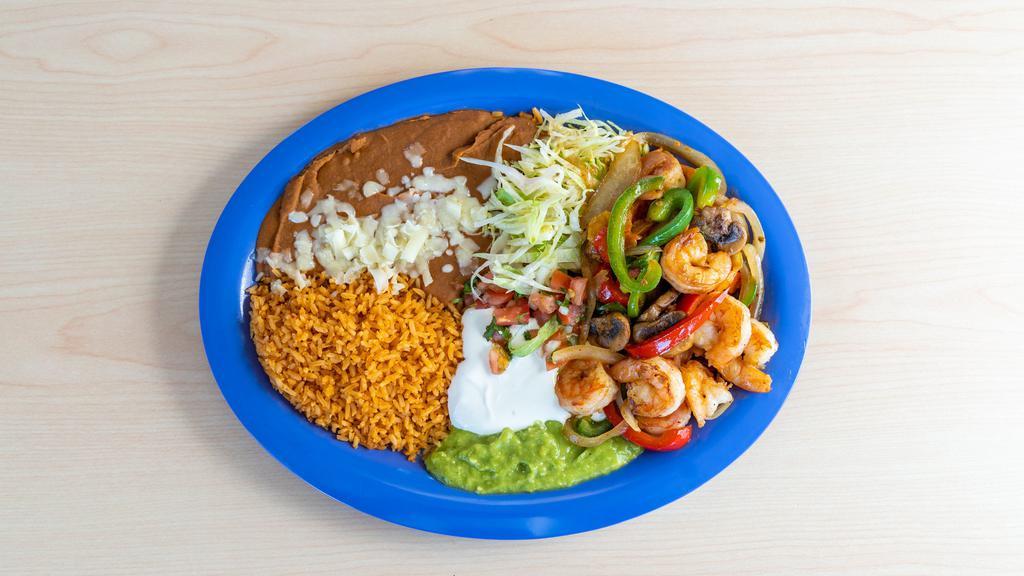 Camarones Fajitas Style · (Shrimp mixed with Grilled Onion, Bell Pepper, Mushroom, Tomato)
Served with:(Rice, Beans, Guacamole, Sour Cream, Cheese, Salsa, Lettuce)