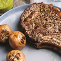Rib Eye Steak · Grilled 5 Star Reserve Bone - In Prime  Rib Eye - Sauteed Vegetables - Garlic Spanich Mashed...